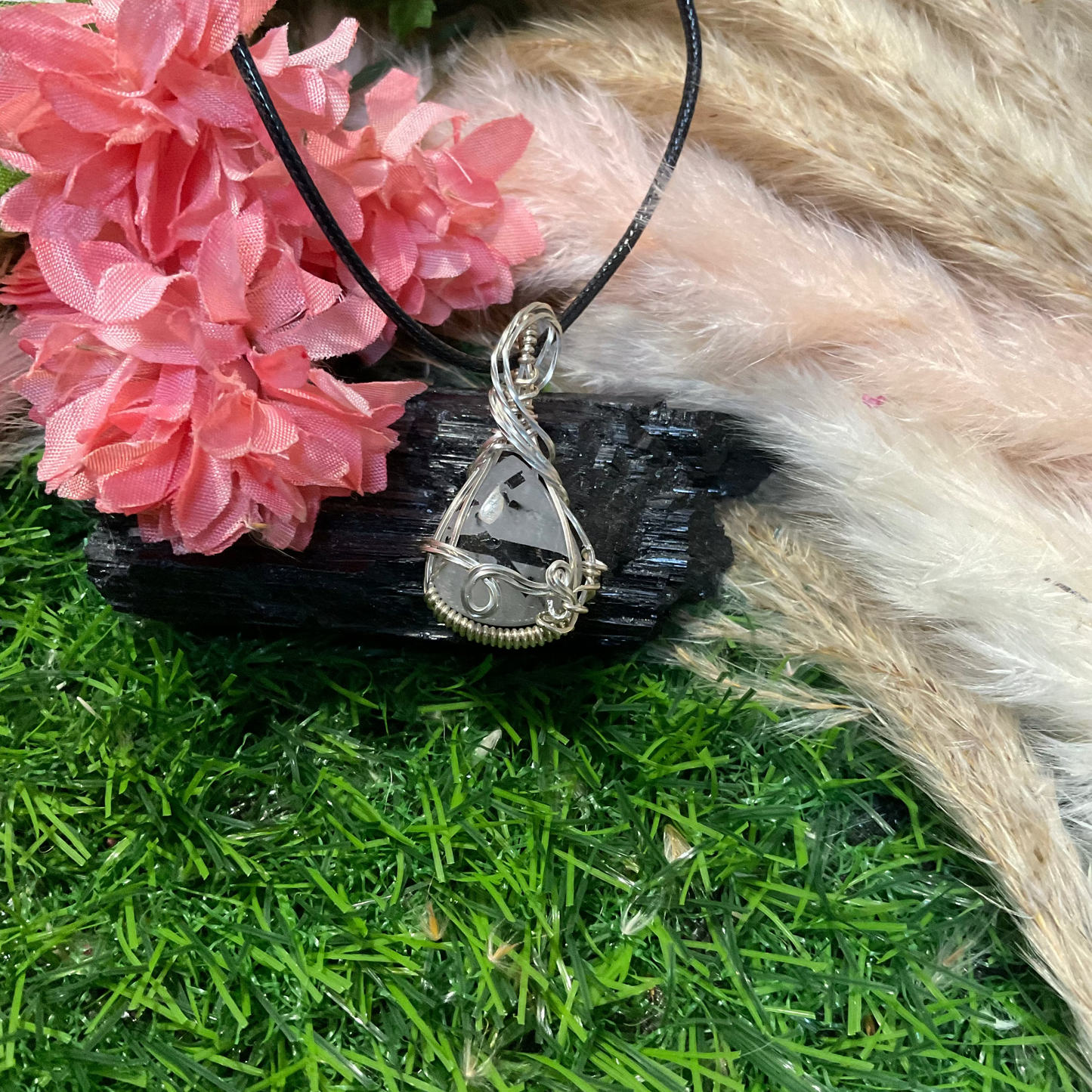 Black Tourmaline Rutilated Quartz wrapped in Sterling Silver.