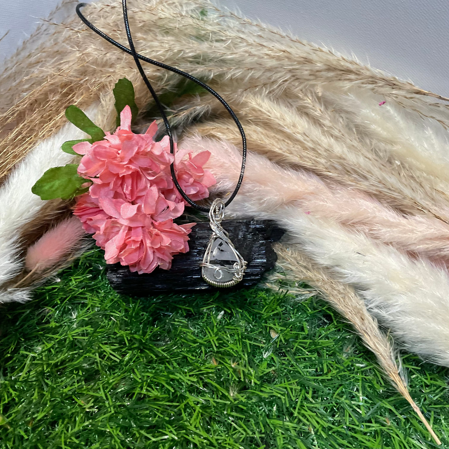 Black Tourmaline Rutilated Quartz wrapped in Sterling Silver.
