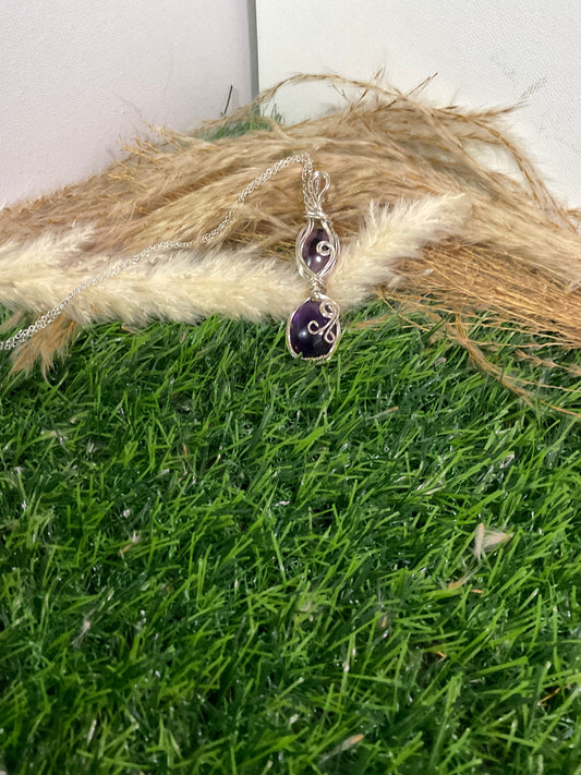 Double Amethyst pendant wrapped in Sterling Silver