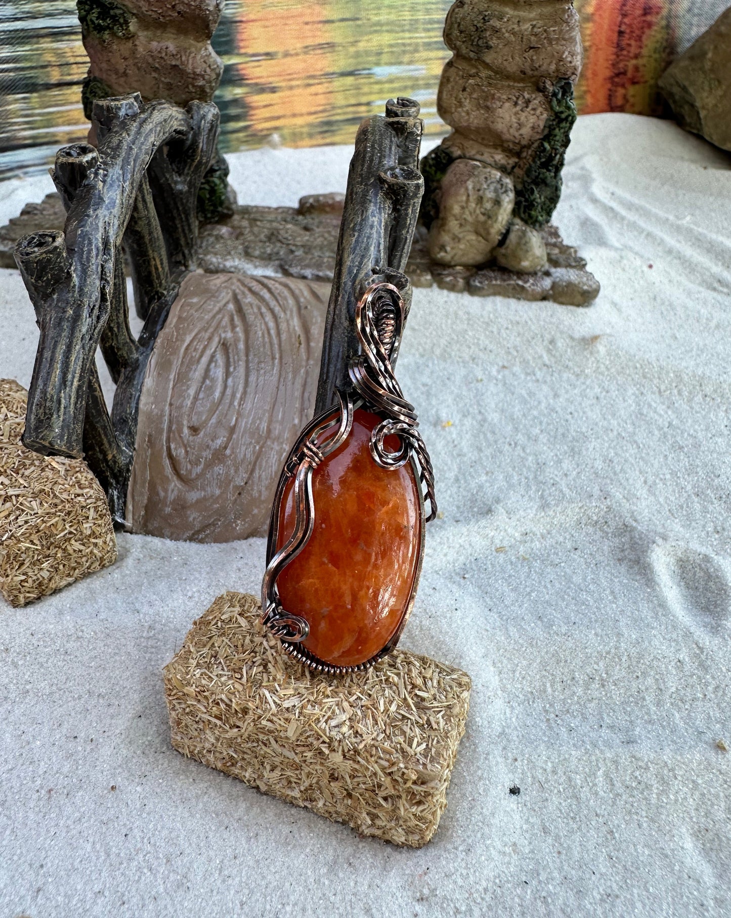 Mandarin calcite wrapped in Oxidized Copper