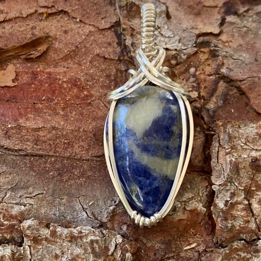 Sunset Sodalite wrapped in Sterling Silver