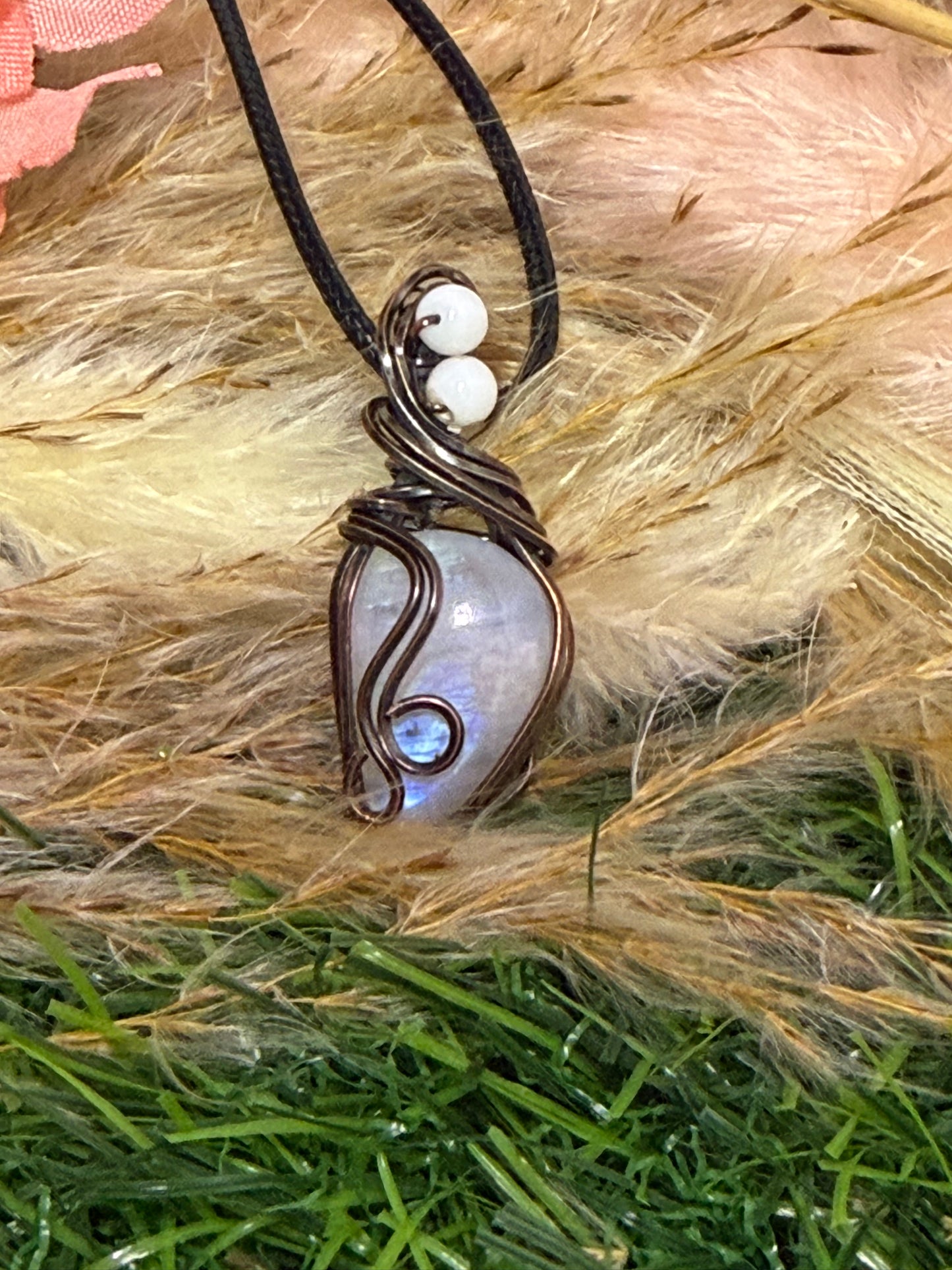 Moonstone pendant wrapped in oxidized Copper