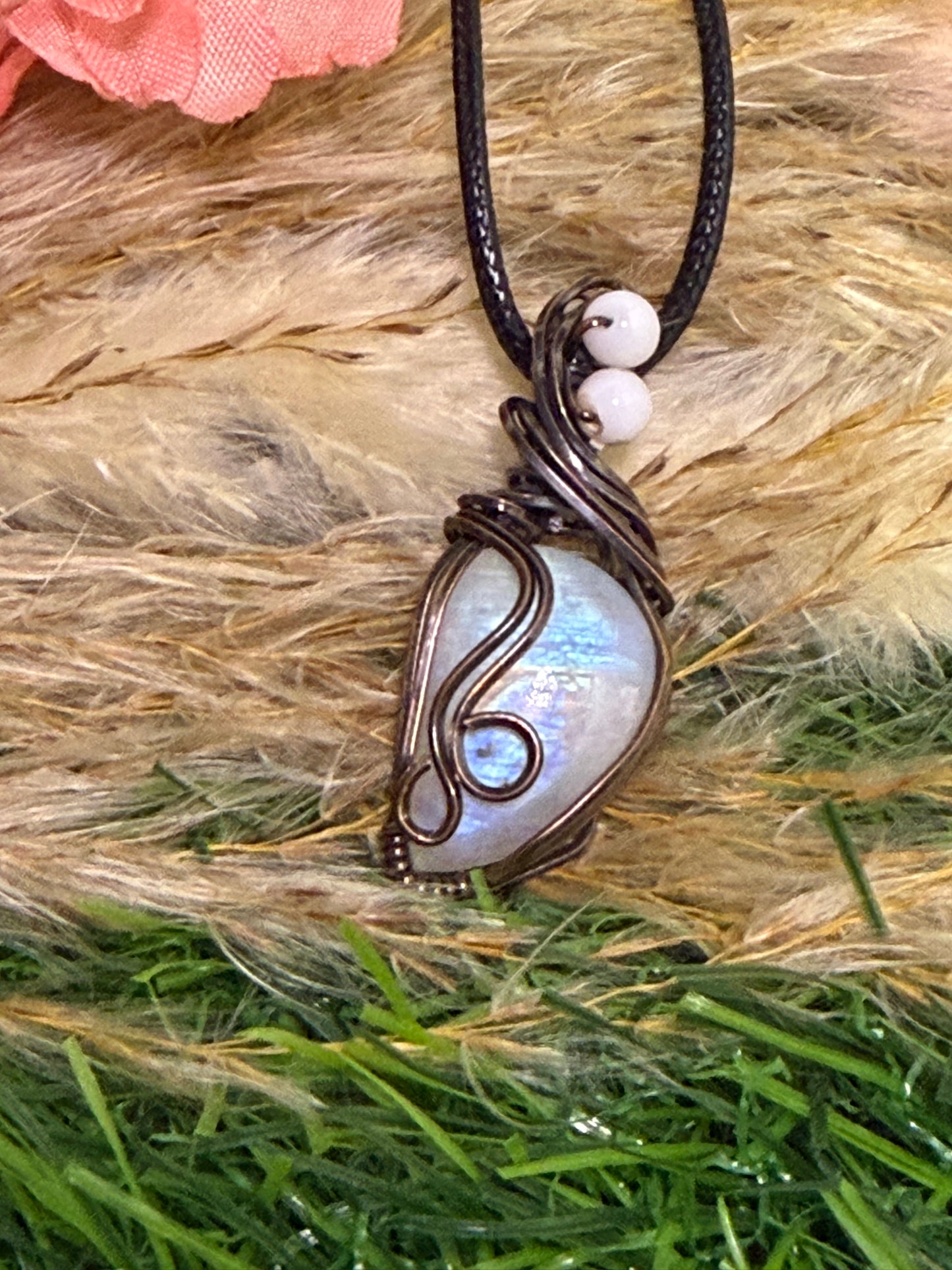 Moonstone pendant wrapped in oxidized Copper