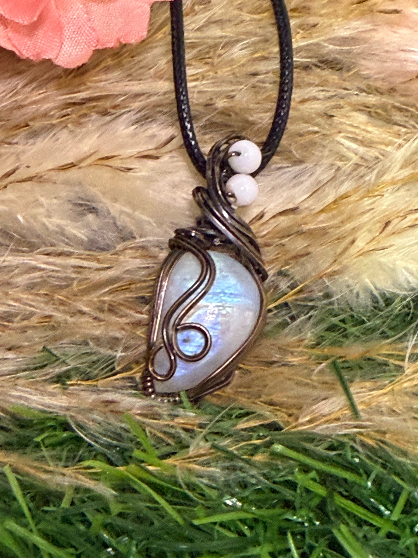 Moonstone pendant wrapped in oxidized Copper