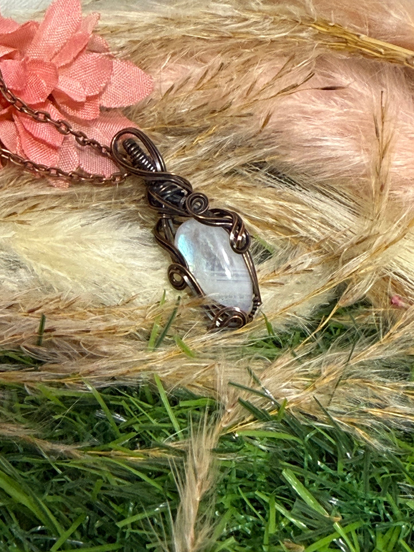 Moonstone pendant wrapped in oxidized Copper