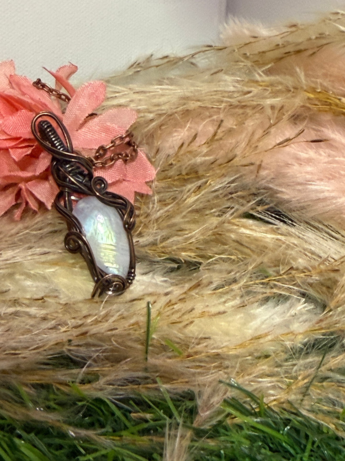 Moonstone pendant wrapped in oxidized Copper