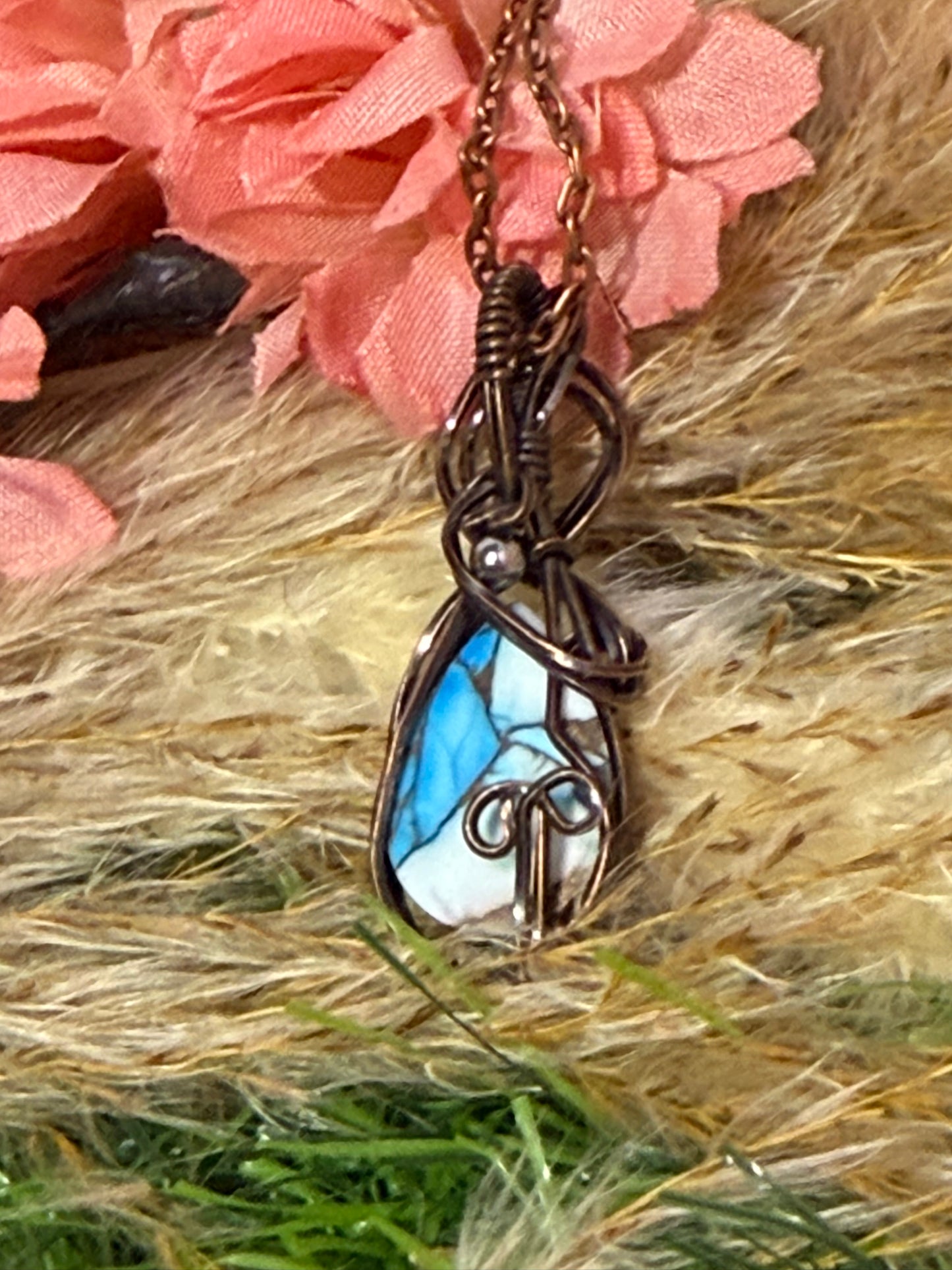 Ice Blue Dahlia pendant wrapped in oxidized copper