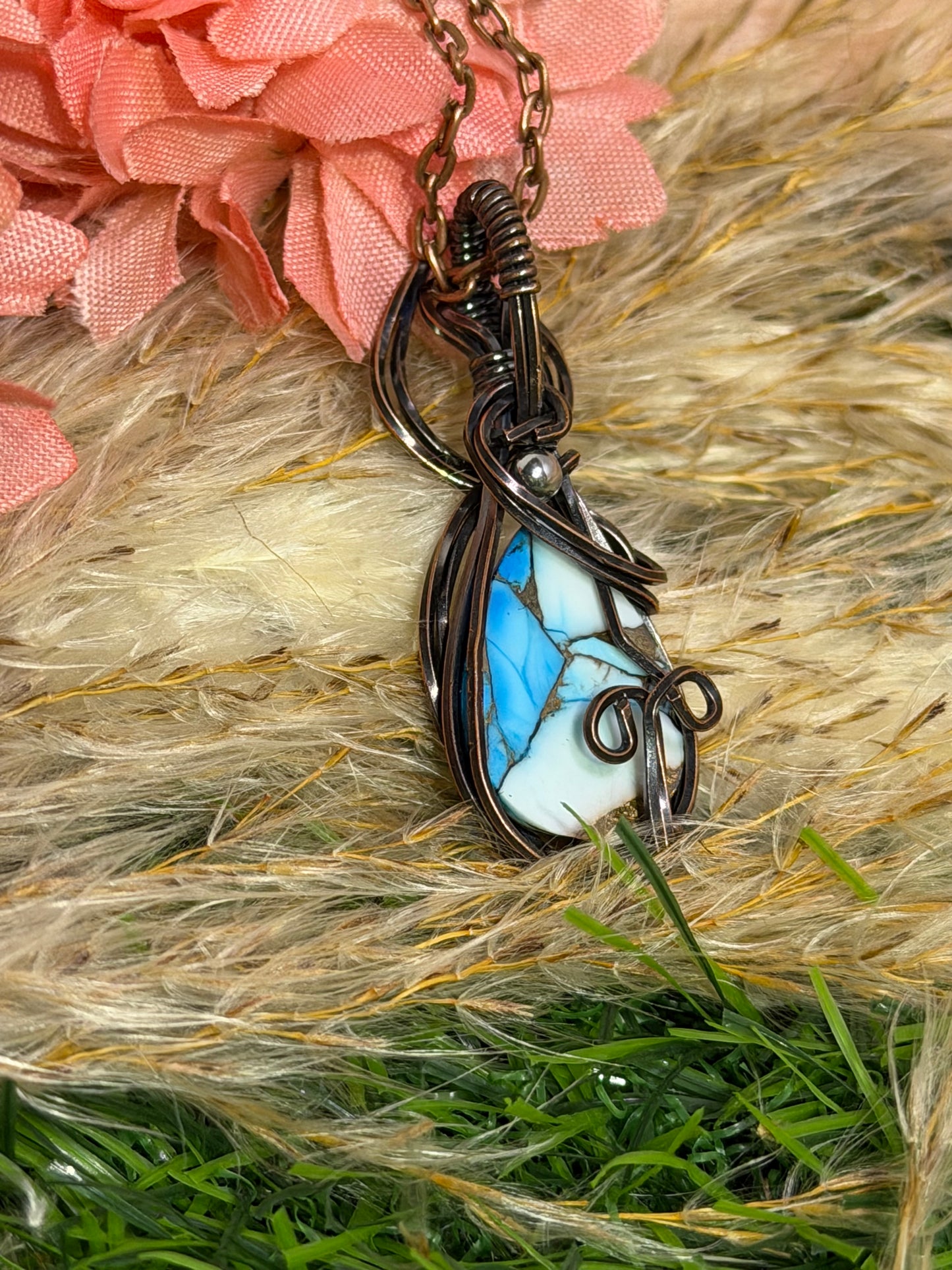 Ice Blue Dahlia pendant wrapped in oxidized copper