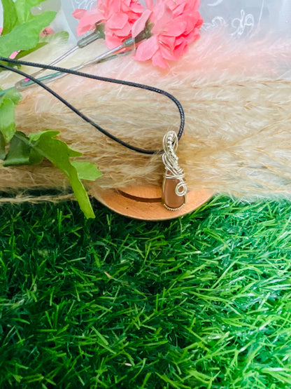 Peach Moonstone pendant wrapped in Sterling Silver