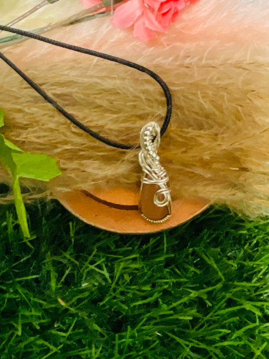 Peach Moonstone pendant wrapped in Sterling Silver