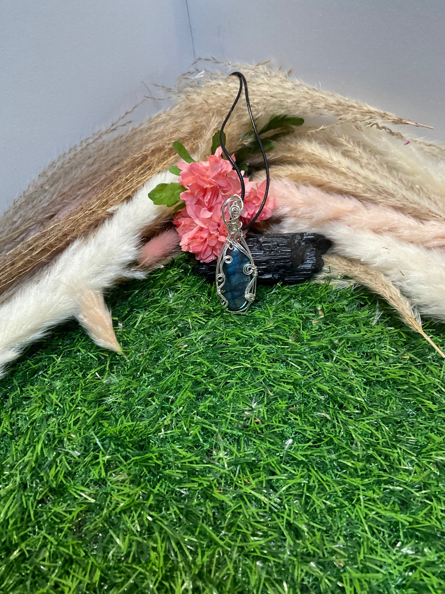 Moss Agate wrapped in Sterling Silver.