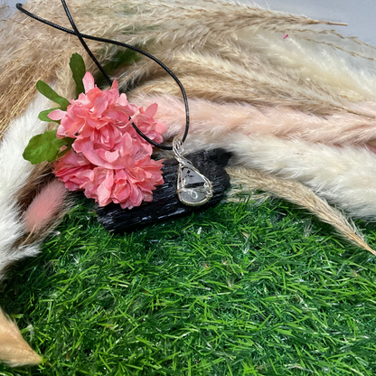 Black Tourmaline Rutilated Quartz wrapped in Sterling Silver.