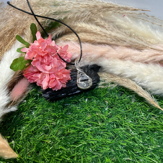 Black Tourmaline Rutilated Quartz wrapped in Sterling Silver.