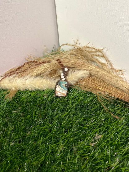 Caribbean Calcite pendant wrapped in oxidized copper