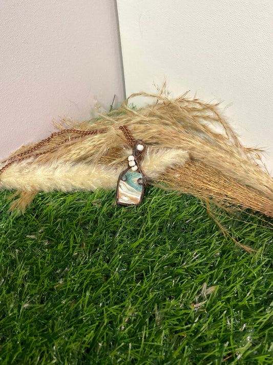 Caribbean Calcite pendant wrapped in oxidized copper