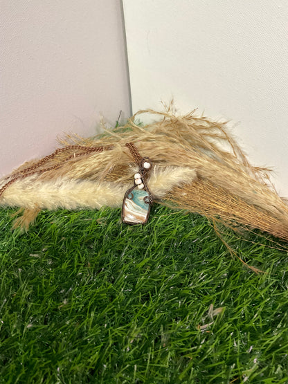Caribbean Calcite pendant wrapped in oxidized copper