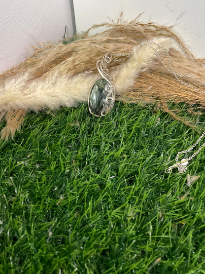 Serpentine pendant wrapped in 9.25 Sterling Silver