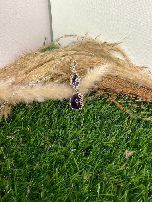 Double Amethyst pendant wrapped in Sterling Silver