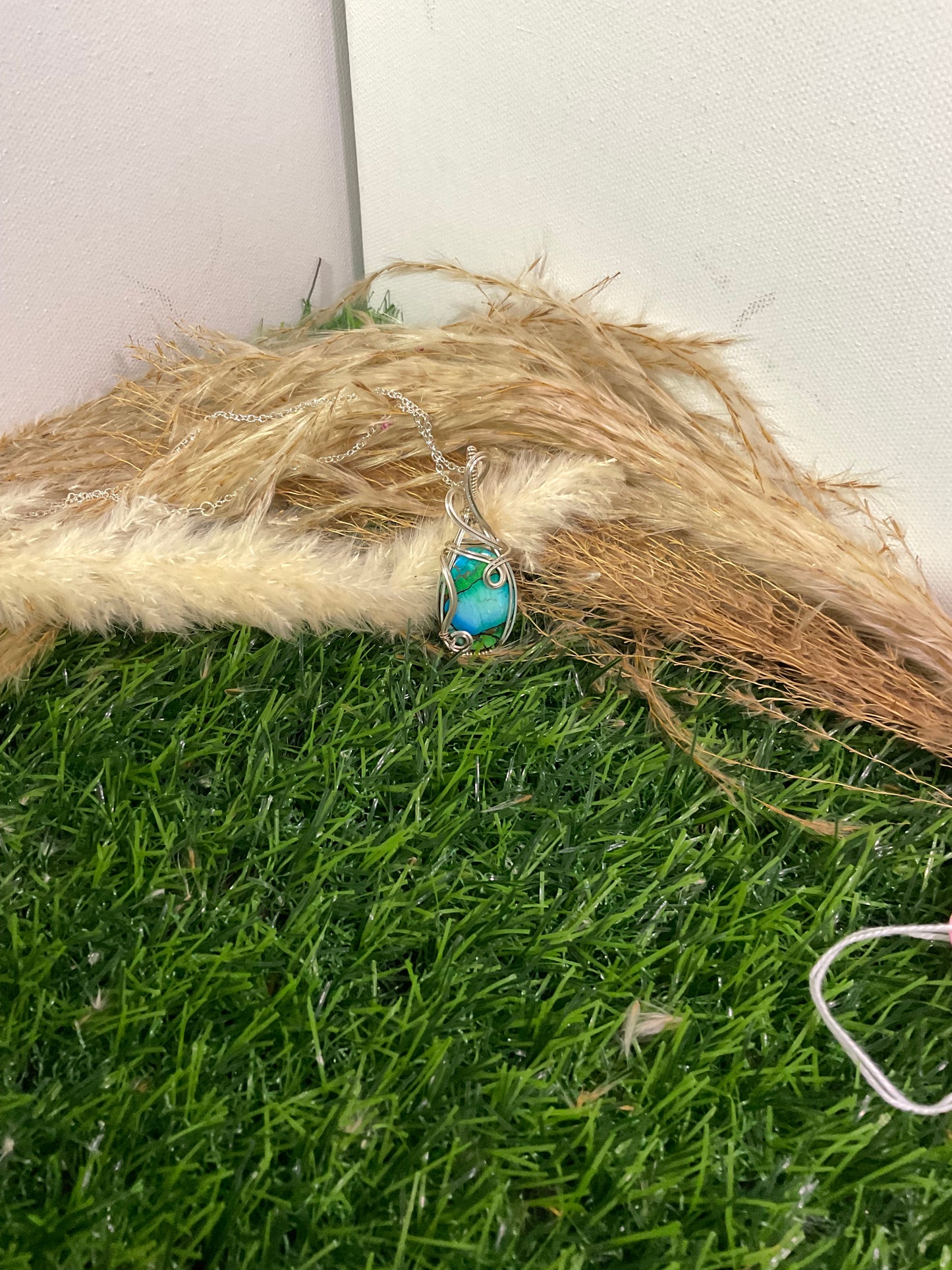 Peacock Dahila Mohave pendant wrapped in 9.25 Sterling Silver