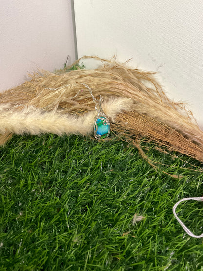 Peacock Dahila Mohave pendant wrapped in 9.25 Sterling Silver