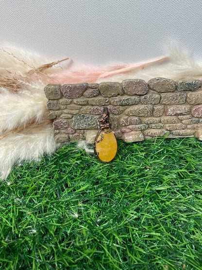 Orange Calcite wrapped in Oxidized Copper-