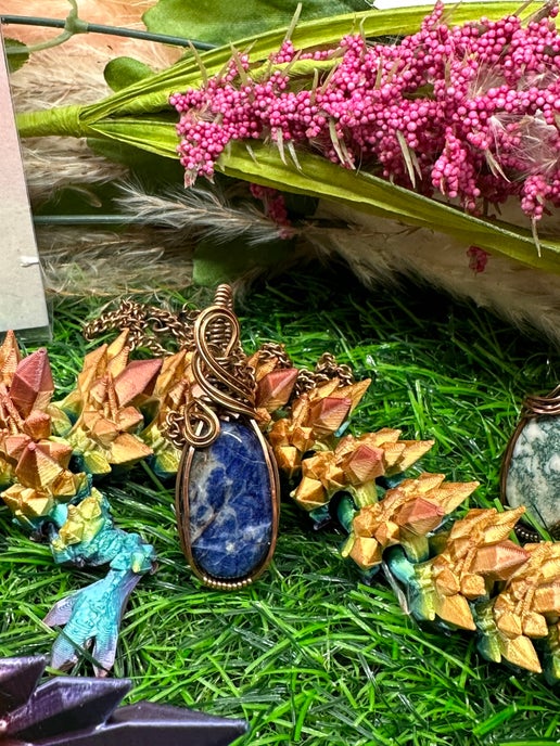 Sunset Sodalite Wrapped in Antique Copper.