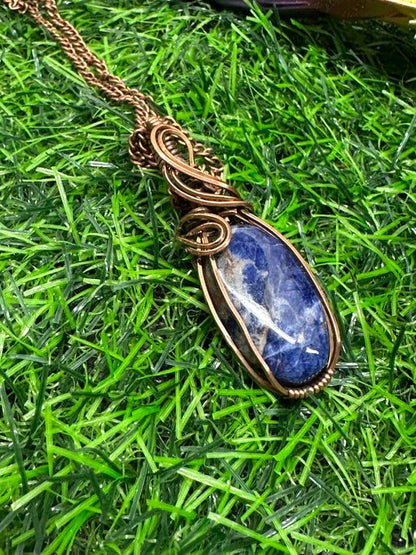 Sunset Sodalite Wrapped in Antique Copper.