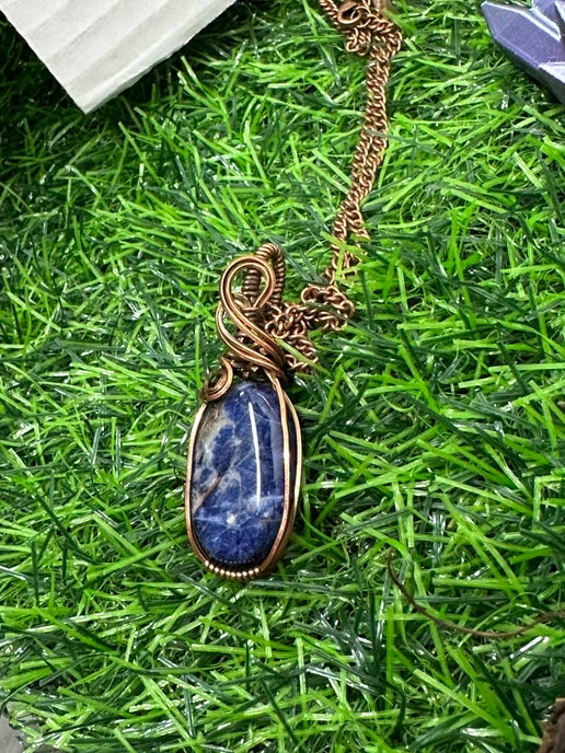 Sunset Sodalite Wrapped in Antique Copper.